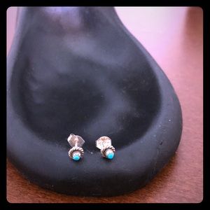 Hand-carved silver and turquoise studs.